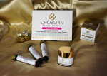 Pack de belleza OROBORN con los suplementos Beauty Collagen y la Crema facial hidratante, sobre tela dorada