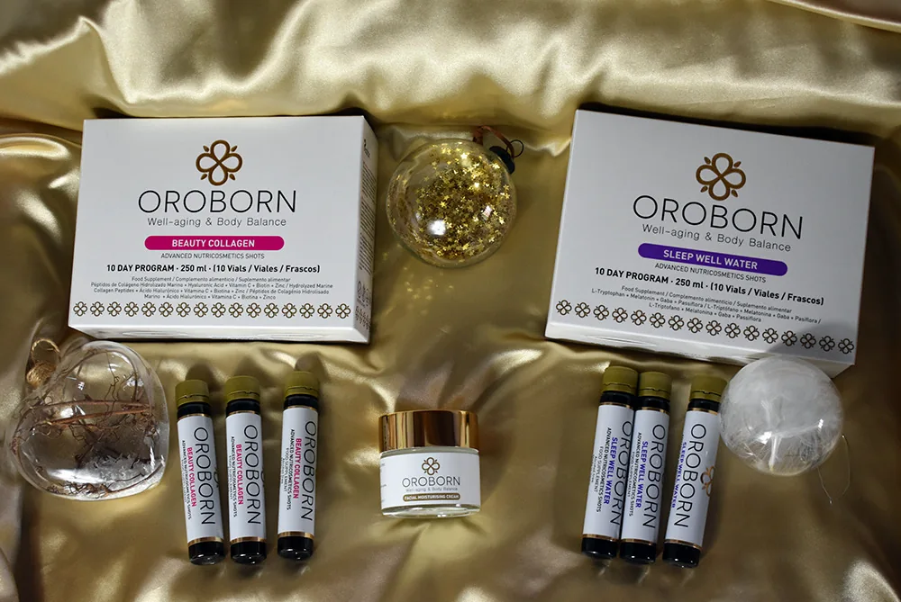 Pack de Belleza y Sueño OROBORN con los suplementos Beauty Collagen, los suplementos Sleep Well Water y la Crema facial hidratante, sobre tela dorada