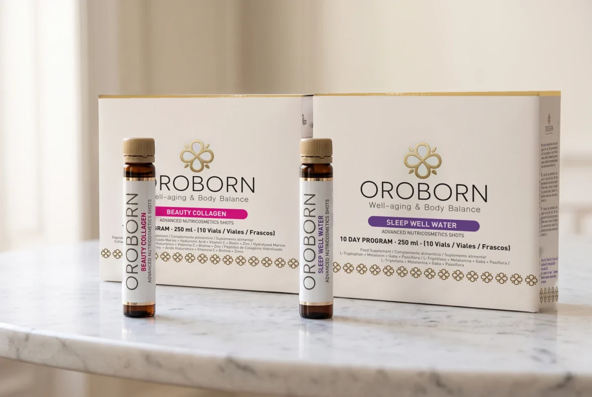Cajas y viales de OROBORN Beauty Collagen y Sleep Well Water sobre mármol: el Ritual Día y Noche